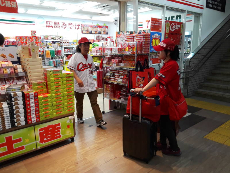 Hiroshima Toyo Carp food and uniforms and hats in the main train station.