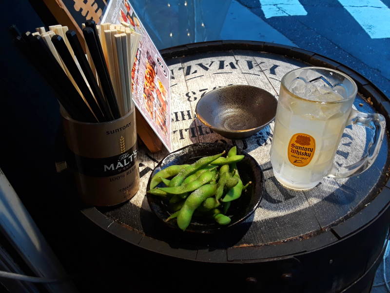 Edemame and highball at the tachinomiya or stand-up bar in Fukuoka.