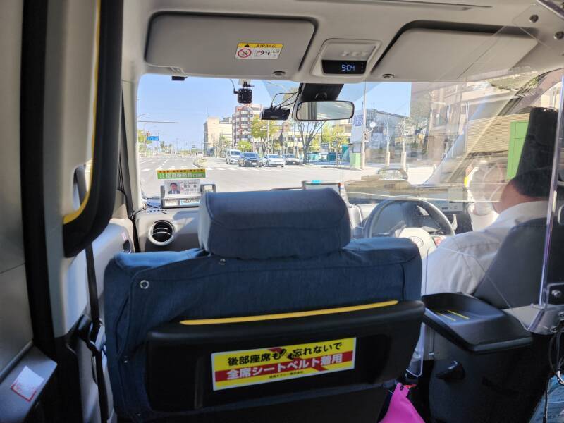 Riding to the ferry port in a taxi.