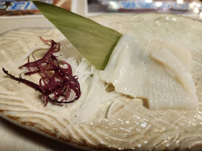 Purple seaweed, white crunchy plant, thin strip-sliced squid. I think...