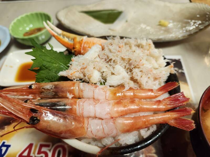 Crab claw with meat, extracted shredded crab meat, three shrimp.