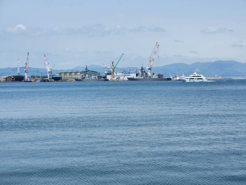 Ferry crosses in front of JMSDF base in Hakodate harbor.