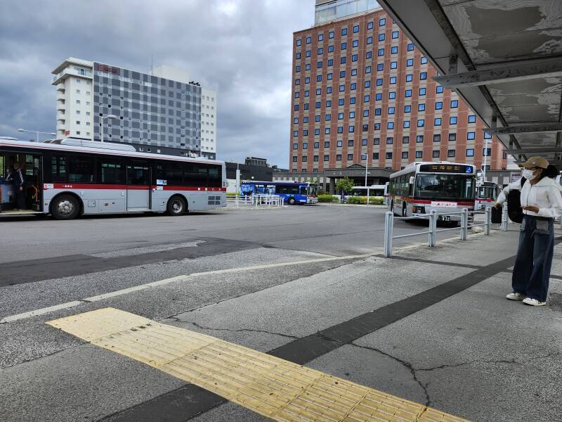 Bus #99 pulls in to pick up passengers.