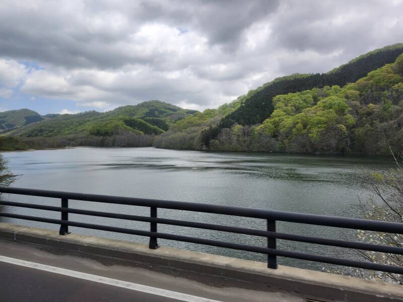 Forested mountains and a large lake.