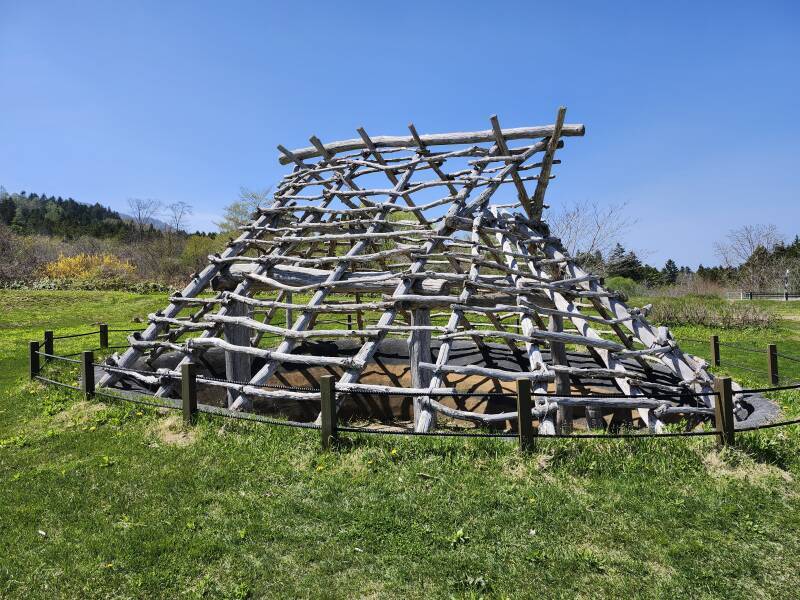 Partially reconstructed pit dwelling.