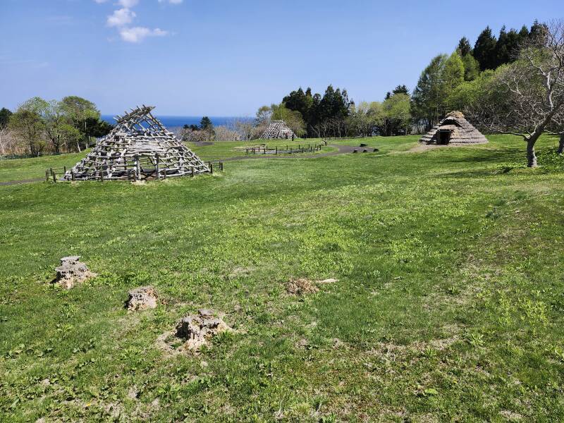 Ōfune Site pit dwellings with the Pacific Ocean in the background.