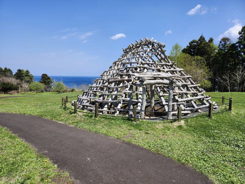 Ōfune Site pit dwellings with the Pacific Ocean in the background.