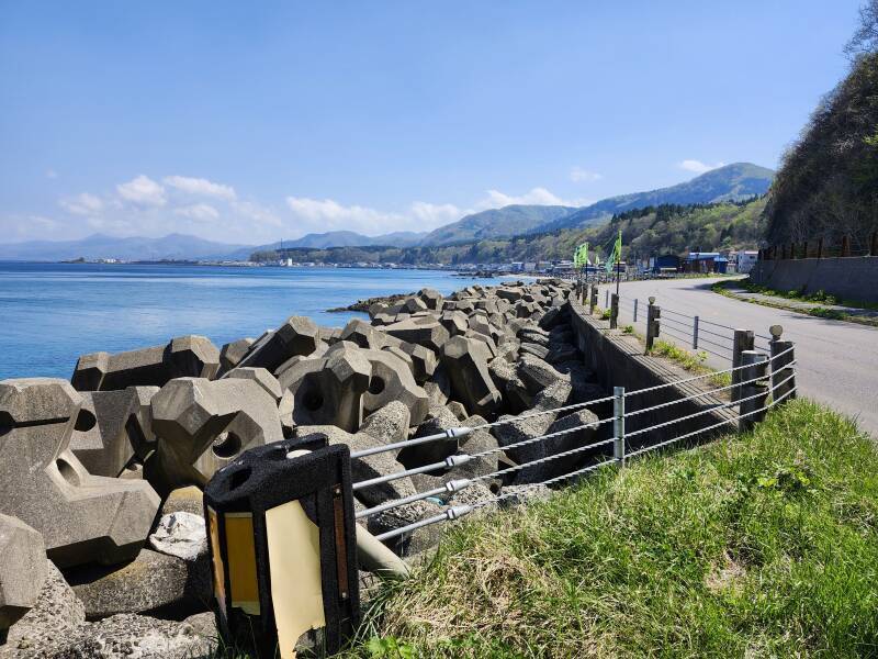 The coast road emerges from a tunnel.