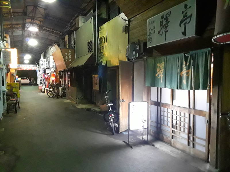 Covered alley with small izakayas, Japanese taverns.