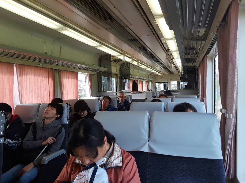 People sleeping on board the Express train from Nagoya to Ise.