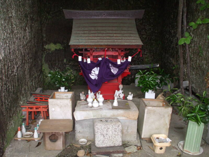 Altar of a Shintō shrine in a yagura or rock-carved tomb in Kamakura.