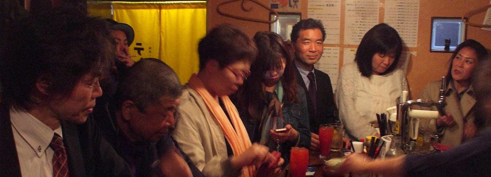People crowded into a tachinomiya, a stand-up bar.