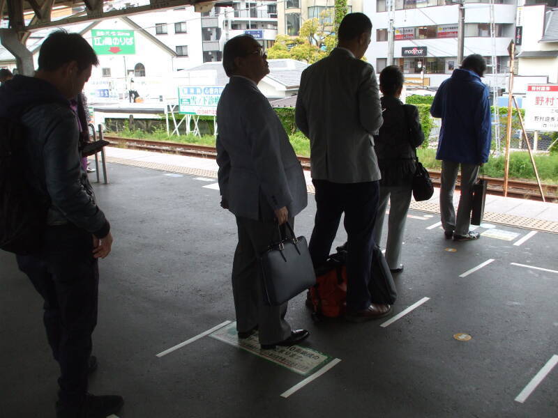 Passengers waiting for the train in train station in Kamakura, Japan.