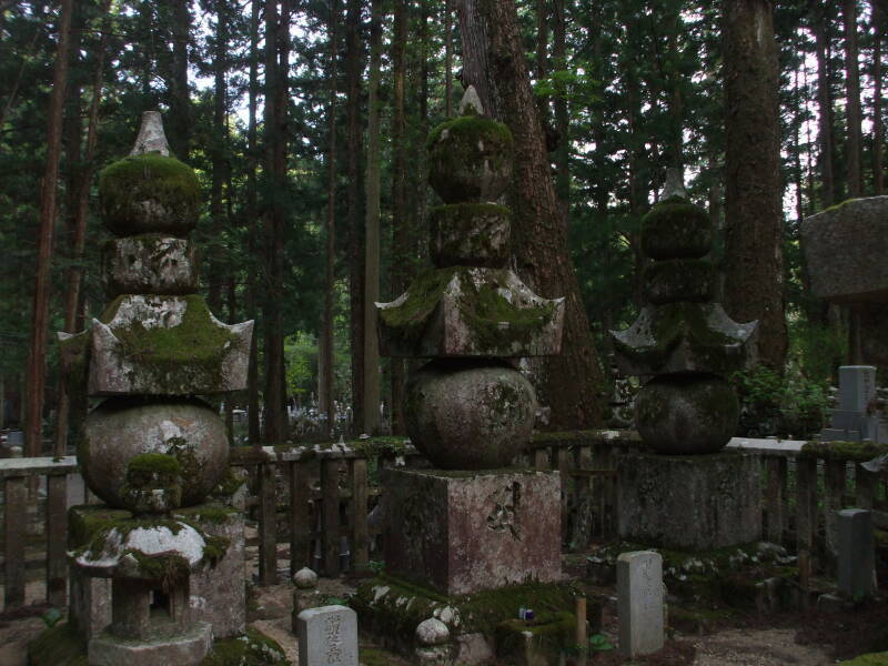 Path through the Okunoin cemetery in Kōya-san, lined with Buddhist tombs.