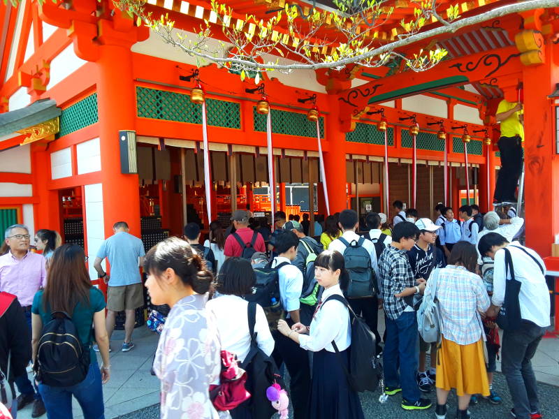 Shintō rite underway in the honden or primary shrine at gate at Fushimi Inari-taisha shrine.