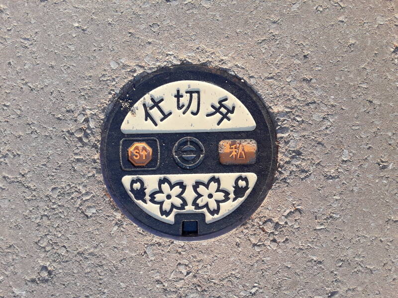 Custom manhole cover at Itsukushima shrine near Hiroshima.