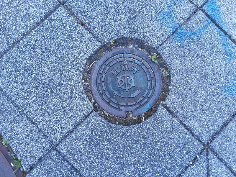 Standardized valve or meter access cover in Kyōto.