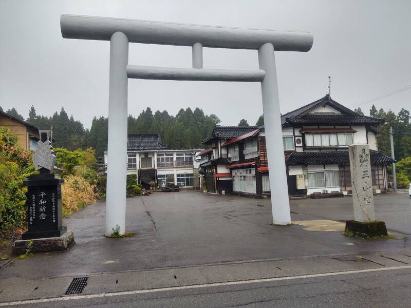 Ryokan with large white torii.
