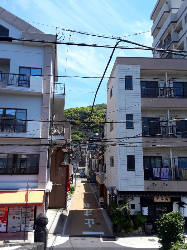 View up a side street leading to the Samurai Path up the hill overlooking Nagasaki Harbor.