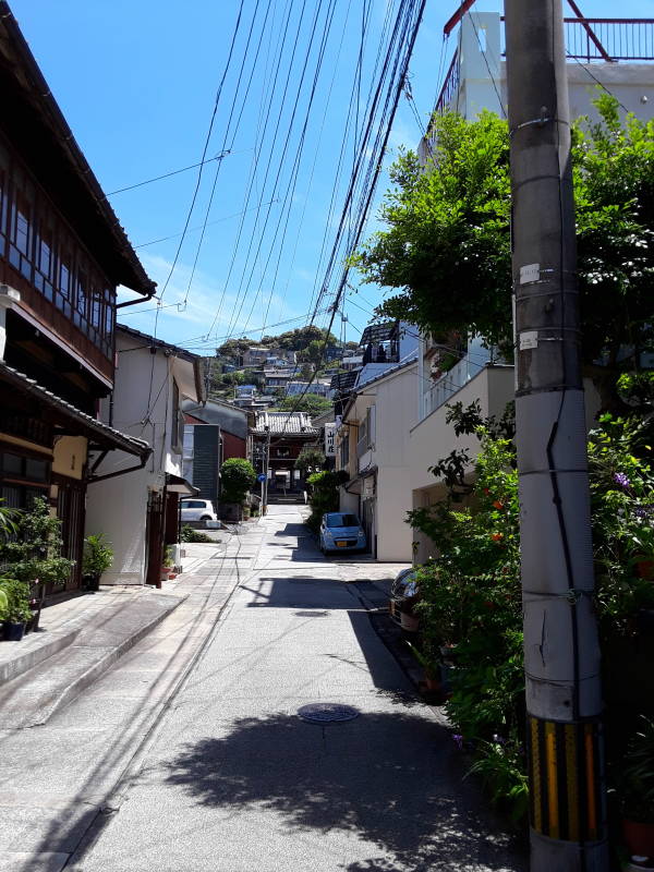 View up a side street leading to the Samurai Path up the hill overlooking Nagasaki Harbor.