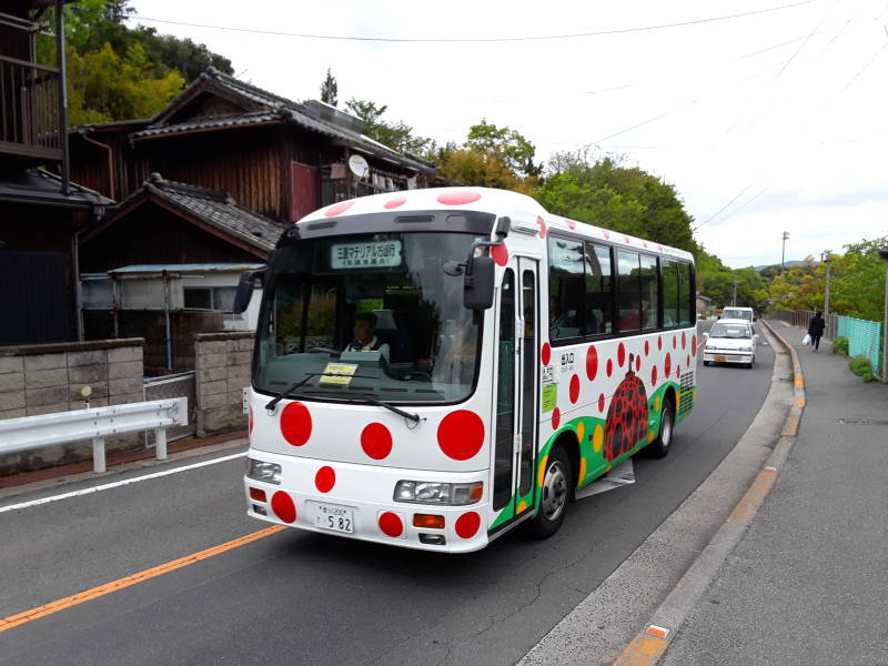 Colorful bus on the road from Miyanoura to Honmura on Naoshima.