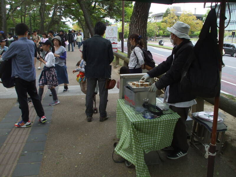 Vendor selling deer crackers for the sacred deer in Nara.