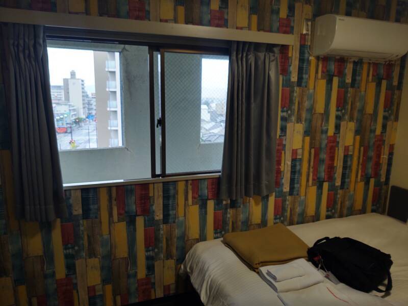 My room in Hotel 910: bed, window.