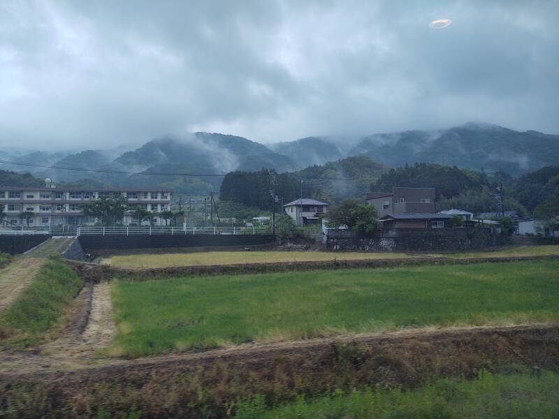 View of misty terrain from board the Sonic Limited Express from Kokura to Ōita.
