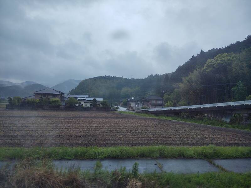 View of misty terrain from board the Sonic Limited Express from Kokura to Ōita.