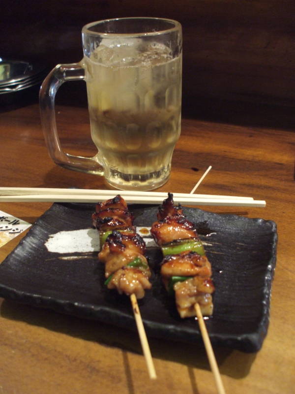 Yakitori and highball in an izakaya in Amerika-mura section of Osaka.