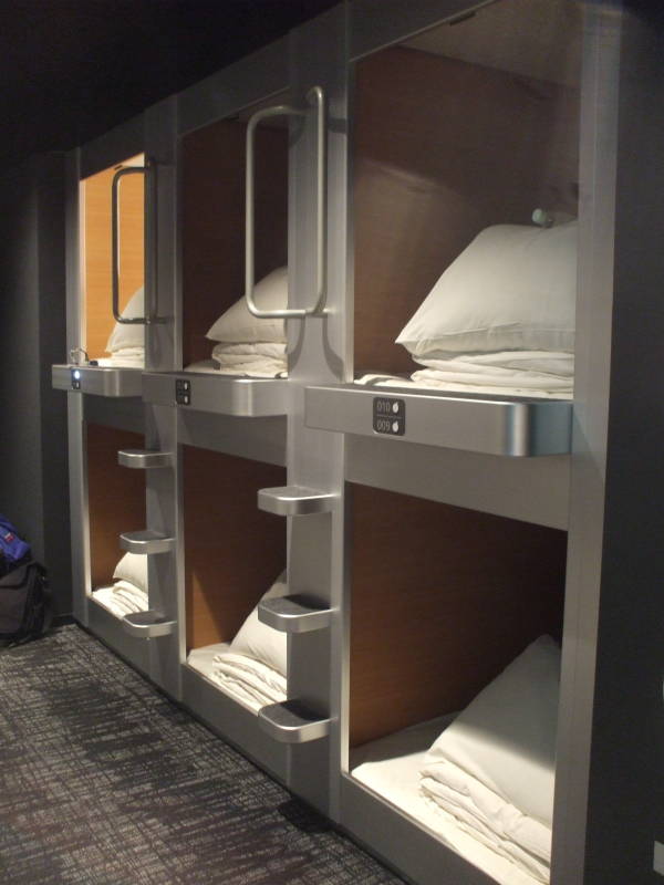 Sleeping capsules in a capsule hotel.