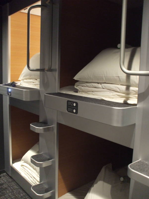 Sleeping capsules in a capsule hotel.