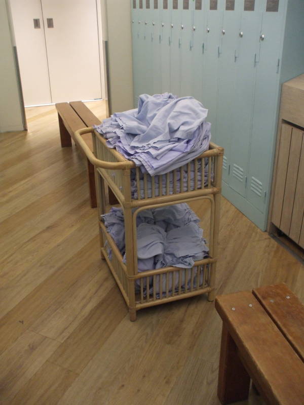 Lockers and baskets of boxer shorts and T-shirts in a capsule hotel.