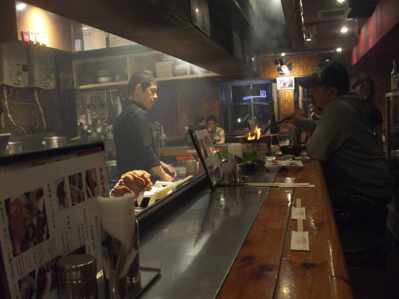 Inside an izakaya in Dōtonbori at night in Osaka.