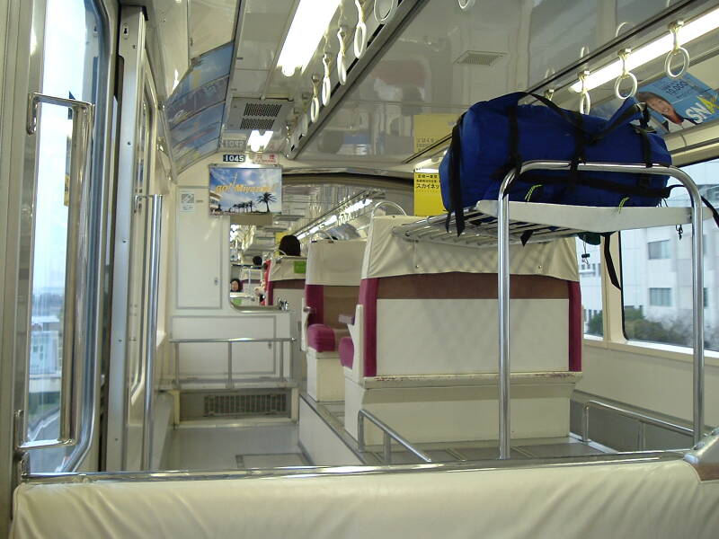 My backpack rides on board the Japanese commuter train.