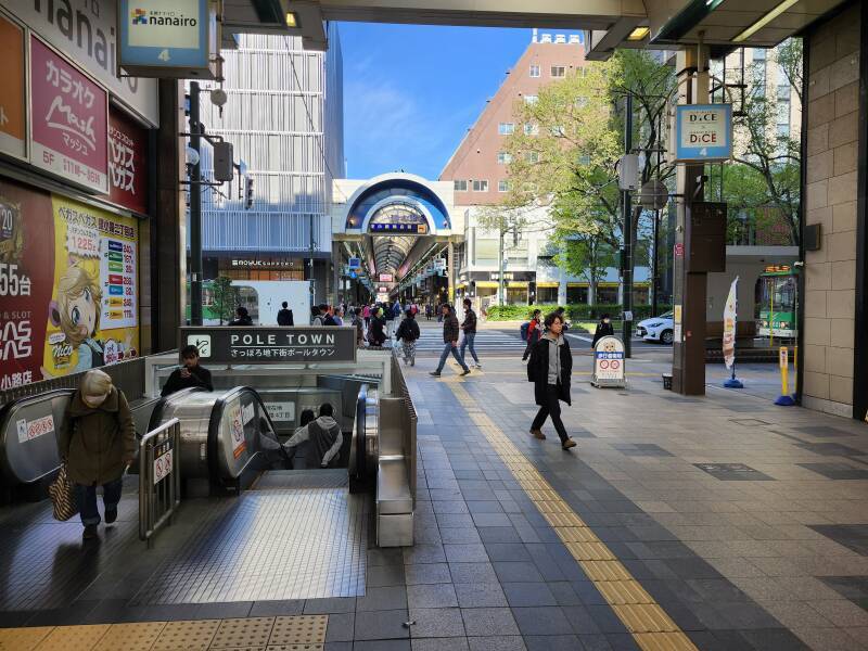 Escalators join Pole Town to Tanukikoji Shopping Street.