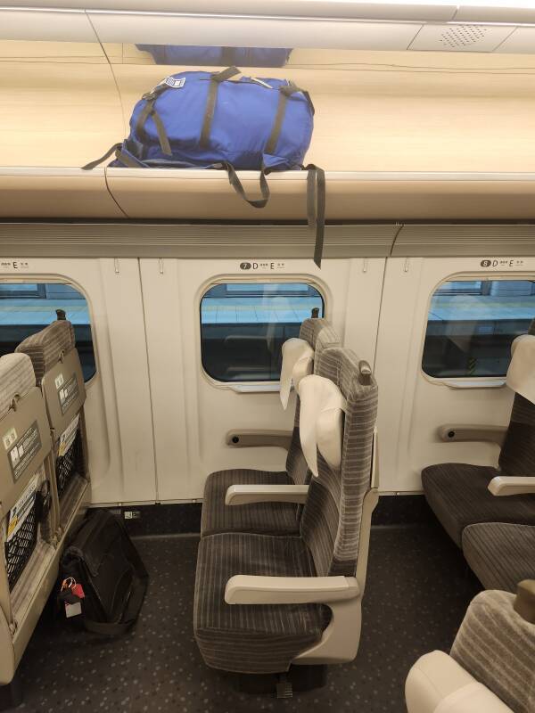 My backpack above my seat on board the Shinkansen.