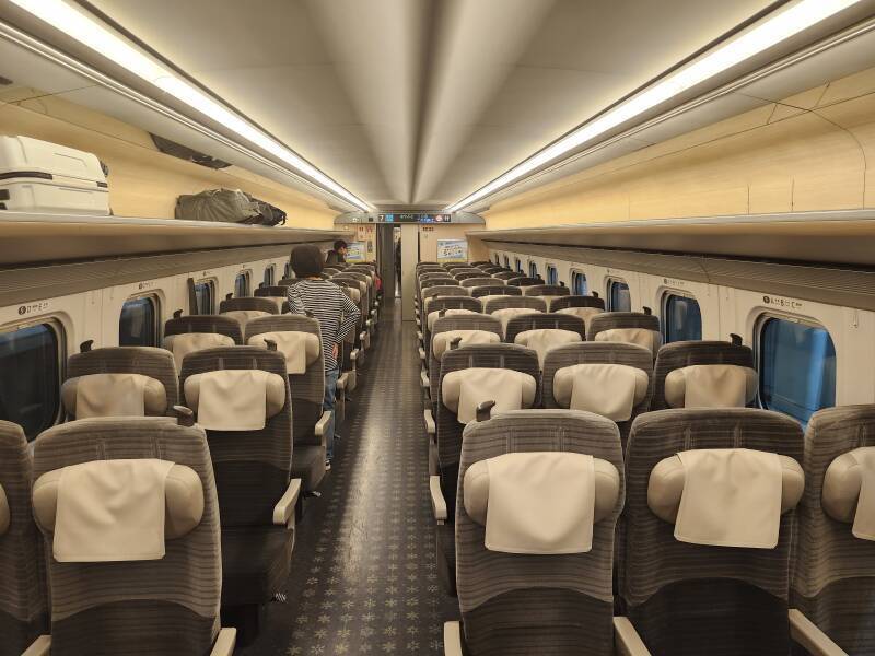 Passengers board the Shinkansen.