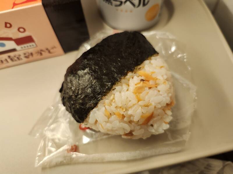 Salmon rice ball with nori wrapper.