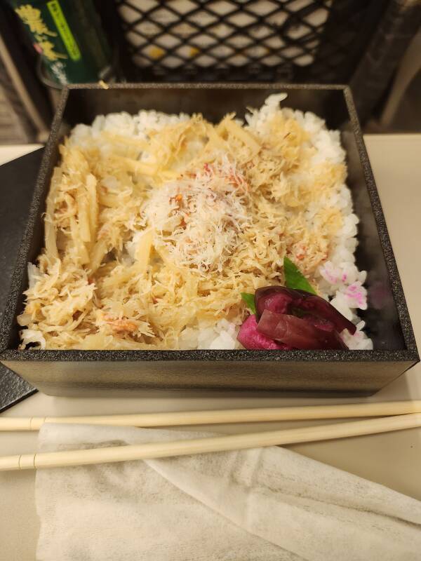 Crab on rice and pickled plum.