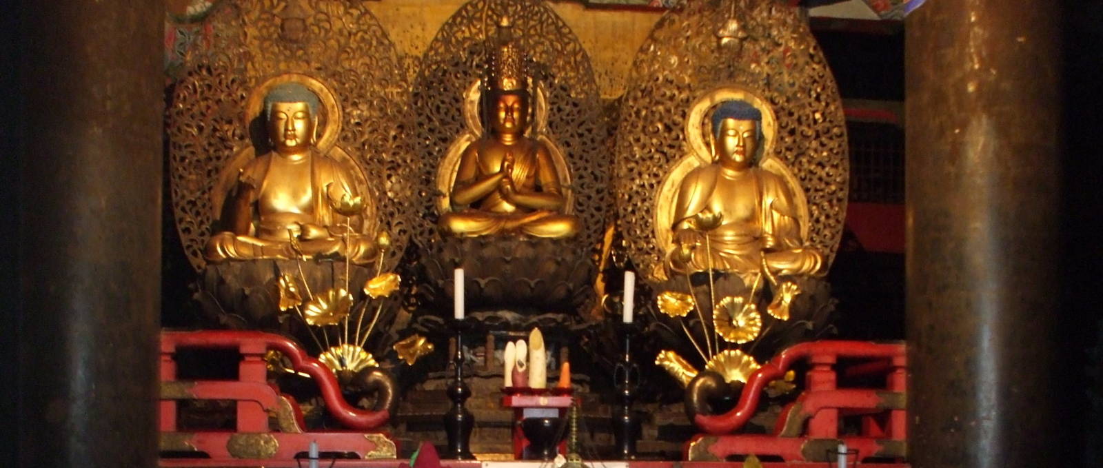 Buddhist statues behind the altar at a temple at Kōya-san.