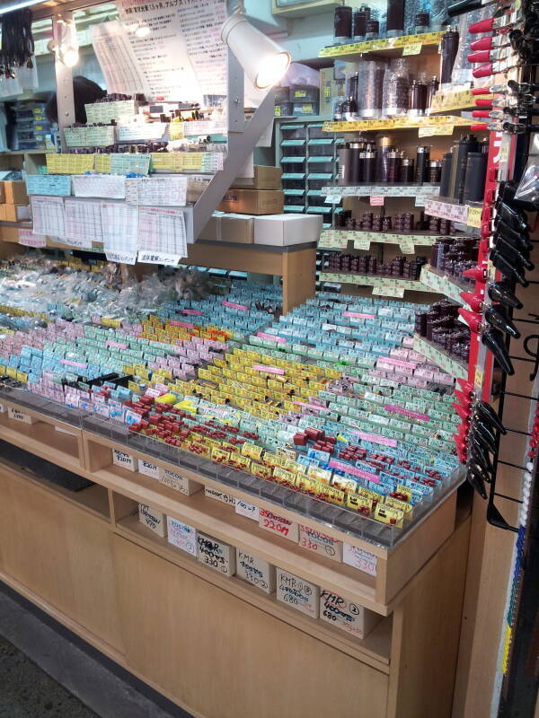 Electronics shop selling nothing but capacitors in narrow indoor passageways in Akihabara.