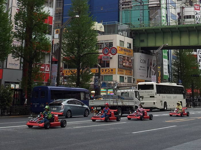 Cosplay go-karts in Akihabara, drivers dressed as Super Mario and the Mario Brothers.