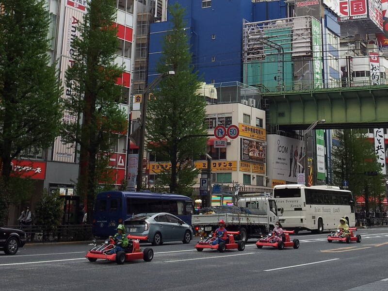 Cosplay go-karts in Akihabara, drivers dressed as Super Mario and the Mario Brothers.