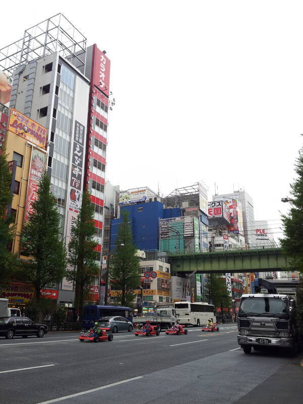 Cosplay go-karts in Akihabara, drivers dressed as Super Mario and the Mario Brothers.