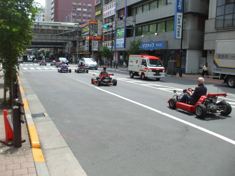 Cosplay go-karts in Akihabara, drivers dressed as Super Mario and the Mario Brothers.