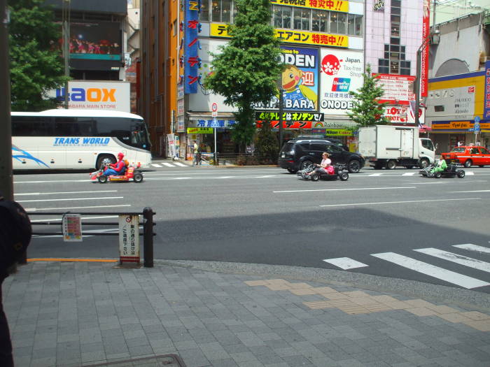 Cosplay go-karts in Akihabara, drivers dressed as Super Mario and the Mario Brothers.