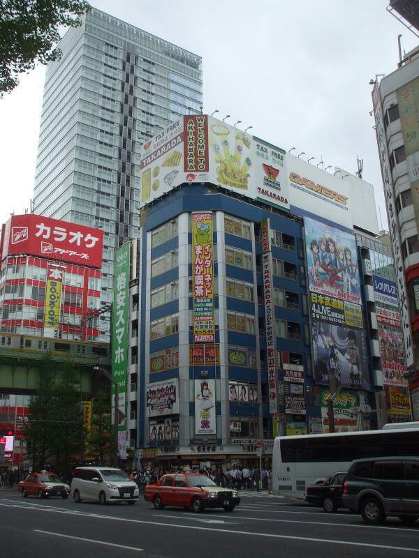 Tall building in Akihabara with a maid café.