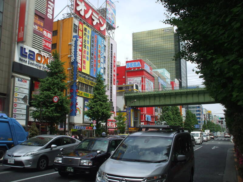 Train line crosses over a busy street in Akihabara.