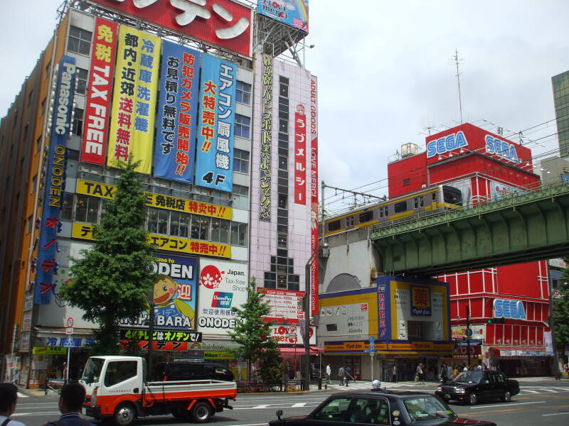 Train line crosses over a busy street in Akihabara.